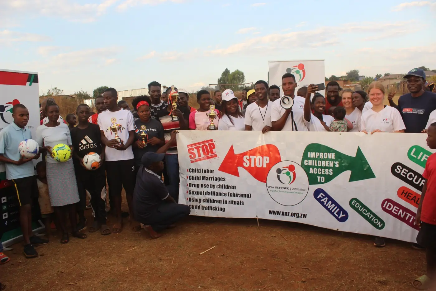 VNZ volunteers and community members at a child-protection awareness event