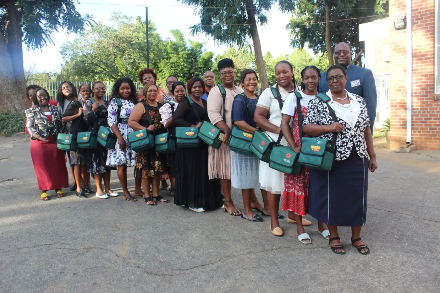 Trained trauma-healing counsellors holding their support toolkits