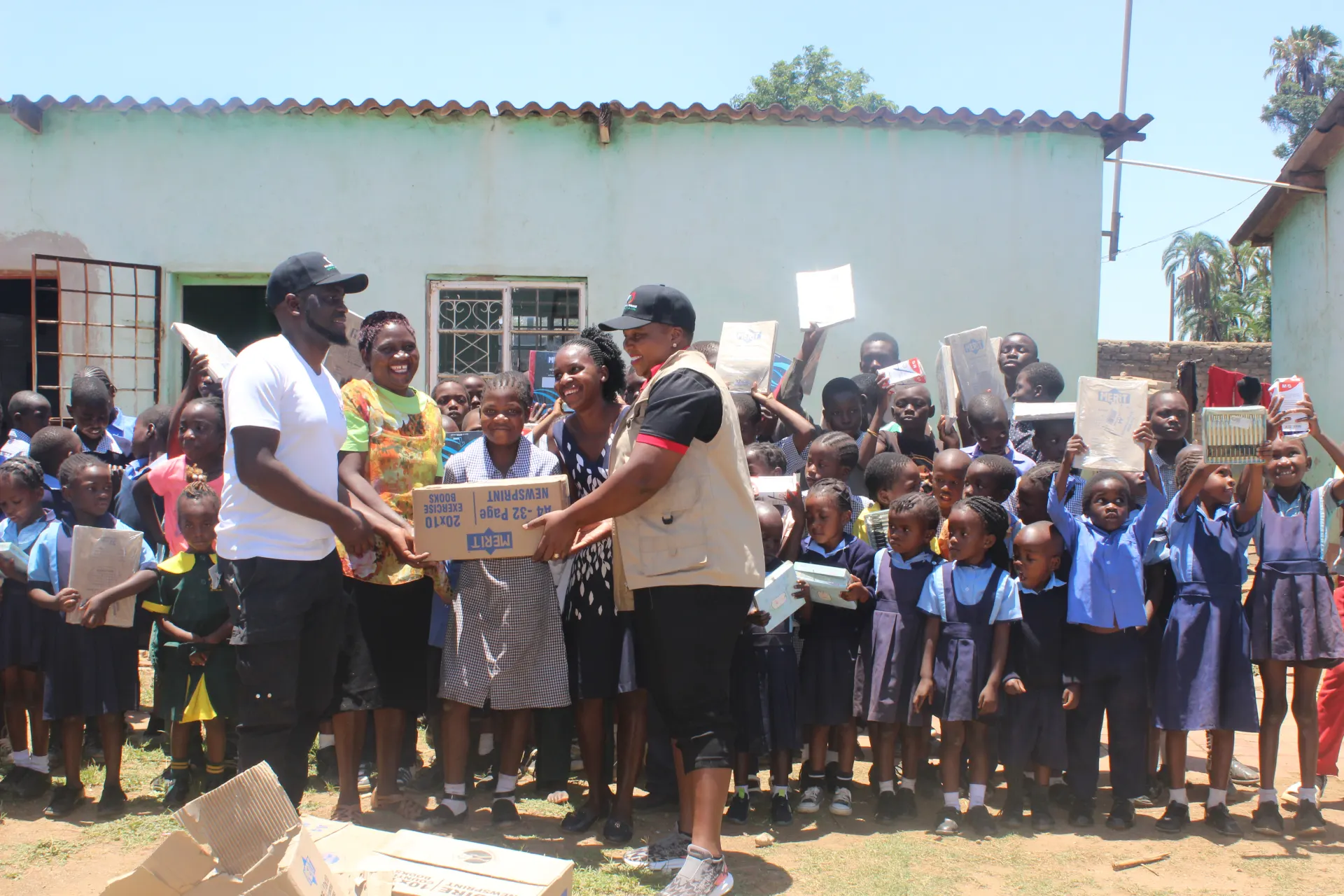 A livelihoods participant presenting fruit from her enterprise